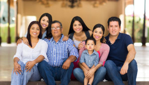 Large family smiling and posting for a photo