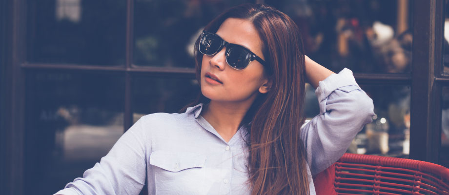 woman thinking about getting veneers