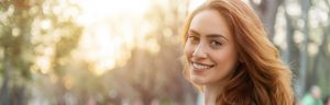 young woman with straight white teeth smiling