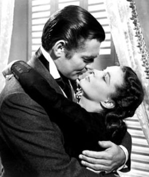 Black and white photo of Clark Cable as Rhett Butler embracing Vivian Leigh as Scarlet O'Hara in Gone with the Wind