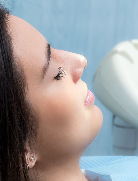 a young lady relaxing in a dental office