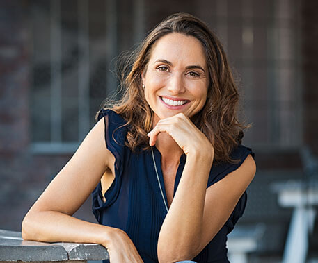 a smiling middle aged woman